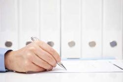 Man Signing Document Man Signing Document