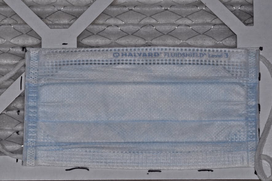Figure 2: Overlay the mask on top of the air filter. Mark size required prior to applying tape to marked area.