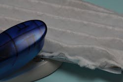 Figure 5: Staple front surface of mask to metal wire mesh side in approximately three sites on each edge. Figure 5: Staple front surface of mask to metal wire mesh side in approximately three sites on each edge.