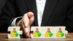 man's hand separating puzzle pieces of wealth man's hand separating puzzle pieces of wealth