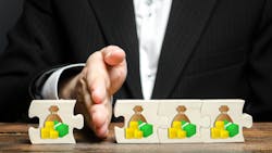 man's hand separating puzzle pieces of wealth man's hand separating puzzle pieces of wealth