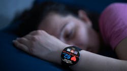 woman sleeping with a wearable sleep watch woman sleeping with a wearable sleep watch