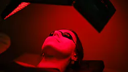 woman using a mask for red light therapy